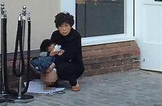 chinese poo outside tourist man boy caught doing burberry takes toilet public shop dump british village twitter cemetery while defecates