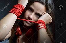 tied young woman rope red beautiful stock
