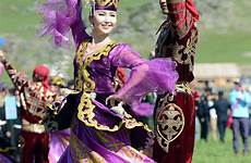 kazakhstan kazakh dance traditional people girl xinjiang clothing fair culture beautiful ethnic 18th enjoying performing couple chinadaily cn choose board