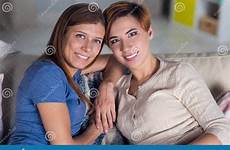 lesbian couple women homosexual hugging couch preview people