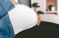 pregnant belly huge stock woman enormous unrecognizable royalty stomac holding istockphoto