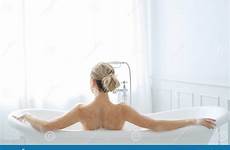 bathtub woman blond stock bathroom relaxing