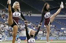 cheerleaders kicking cheerleader