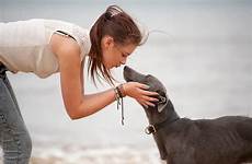 dog girl her kissing teenage pet stocksy