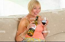 drunk woman drinking wine old stock senior bottle alamy alcohol