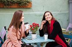talking coffee women cafe two drinking outdoor beautiful smiling young