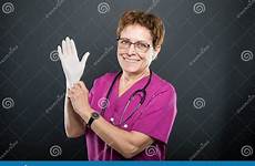 gloves putting sterile senior doctor portrait lady preview