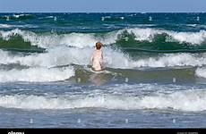 skinny dipping beach stock alamy germany wustrow mecklenburg waves wind west woman