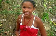 dominican republic girl young alamy stock holding flower red high beach