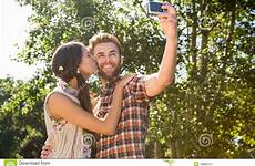 selfie hipster taking couple stock