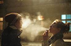 smoke face blowing cigarette other each two girls stocksy marija kovac perfect