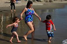 swimsuit moms put kids swimming suits children turner jessica time water splashed laughed spending had