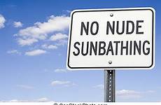 sunbathing nude stock