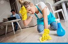 scrubbing floor laptop using woman man while room men marriage couple