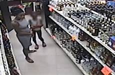 caught woman child camera store shoplift steal shoplifting teaching liquor video florida