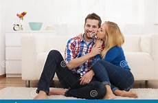 couple living room spending affectionate together time stock
