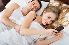 cheating spouse laying texting