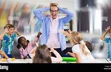 naughty teacher school students stock kids frustrated child classroom alamy empty against interior resolution high