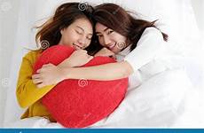 lesbians holding asia willow shape together heart young cute red