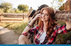 redhead cowgirl ranch cute fence resting cheerful stock farm sitting