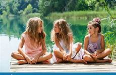 girl three sitting jetty friends lake young threesome female dreamstime conversation preview