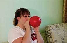 blowing balloon