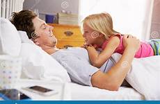 daughter father bed together lying stock preview child