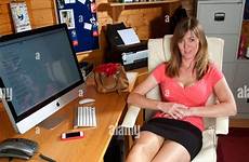 office legs her woman stretching alamy stock chores break taking