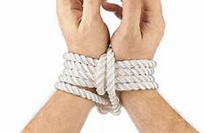 tied rope hand hands bondage bound isolated human stock male