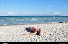 beach sunbathing spain mallorca woman alcudia adult europe mid alamy shopping cart