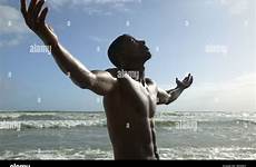 arms stretched man alamy sun beach