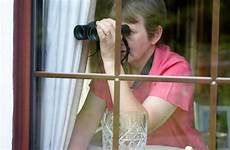 neighbour window nosey neighbors binoculars spying watching insurance texting stock istock premium auto know freeimages getty