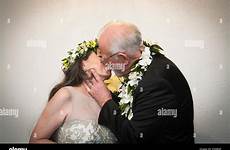 kissing older man young woman bride groom alamy stock wedding outdoors