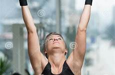 leg raises hanging woman performing exercise fitness exercises preview