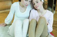 teen tights girls sitting wearing two slippers fireplace length camera looking dissolve d984