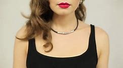 Beautiful woman with red lipstick licking her lips.