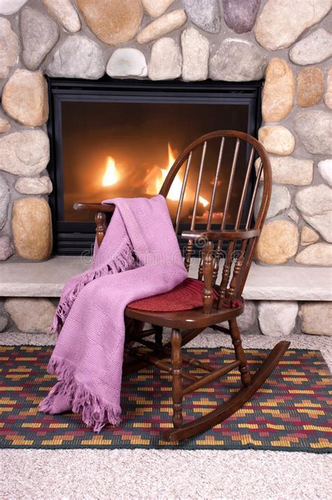 Like i mentioned, we kept our fireplace depth pretty slim because we didn't want it to stick out very far from the wall, but you could easily get the same finished look on the front and use deeper trim pieces to get a deeper profile. Wood Rocking Chair In Front Of Home Fireplace Stock Image ...