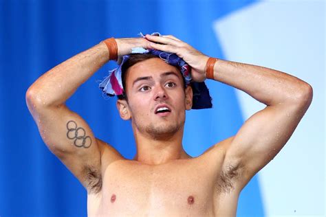 Just olympic champ @tomdaley1994 knitting in the stands while watching the diving. Olympic diver Tom Daley admits cybersex despite engagement