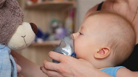 It'll be hard to get your little one out of the tub with a bath toy this fun. One year old baby boy inhaling from the inhaler, her ...