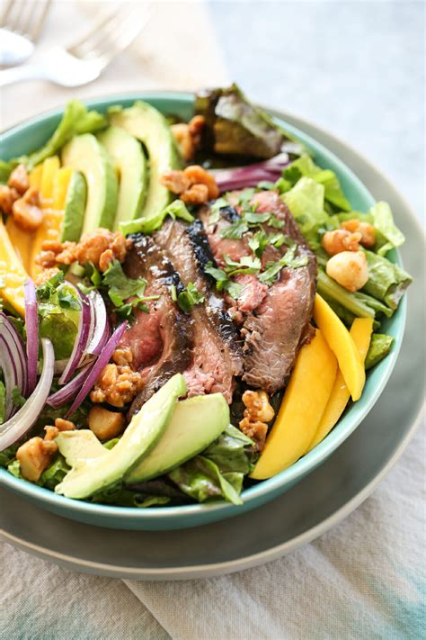 Because the broccoli stays raw for this dish, you want to make sure the pieces are small enough to become fully coated and soften in the dressing. Steak and Mango Salad | Our Best Bites