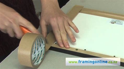 To frame the canvas, you simply slip the painting into the frame from the back as usual. How to Frame a Picture: Taping the Back - YouTube