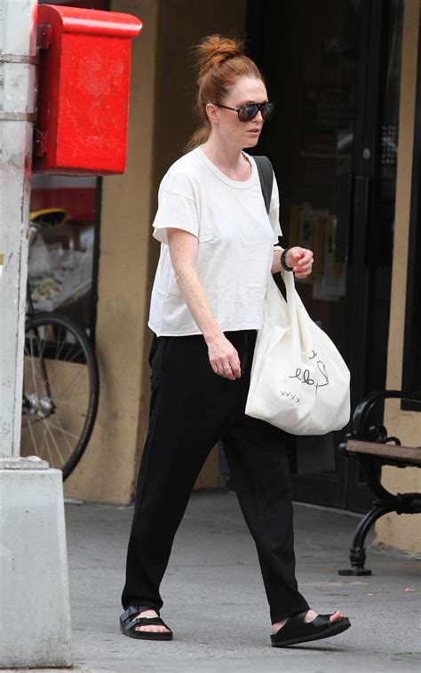 Julianne moore's bare feet as she is removing her feet from some shoes. Julianne Moore's Feet