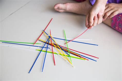 Hold them vertically, or perpendicular to the ground, about a few inches above your playing surface. How to Play the Gratitude Game with Pick Up Sticks | Pick ...