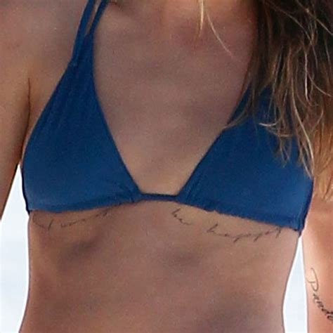 Cara delevingne has many tattoos on her body. Cara Delevingne's 17 Tattoos & Meanings | Steal Her Style