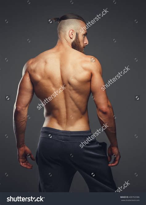 There are around 650 skeletal muscles within the typical human body. Muscular man's back on a grey background. in 2020 | Male ...