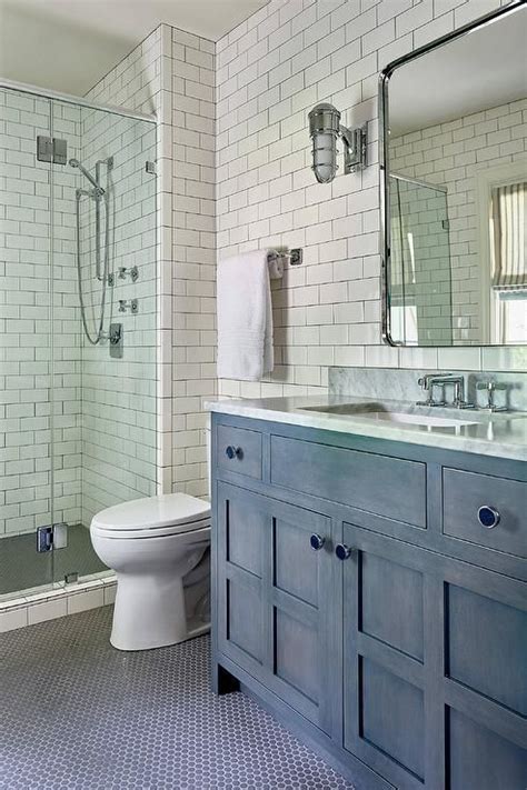 Whether they're all the same size or varying dimensions, round penny tiles in glass, marble, shell, or metal can create an intricate pattern for a shower floor or wall, a classic kitchen backsplash straight. A+Restoration+Hardware+Bristol+Flat+Mirror,+lit+by+cage ...