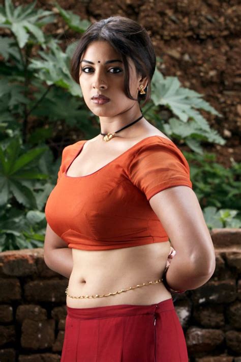 Shriya saran hot cleavage show pics in low cut sleeveless blouse and transparent saree. Desi mallu aunty tight blouse cleavage images in HD