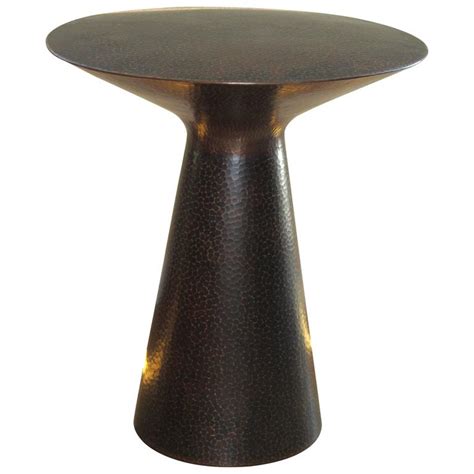 They serve many uses, from nightstands, bookshelves to end tables, and sometimes even double up as study tables. Hand-Hammered Copper Artisan Crafted Side Table at 1stdibs