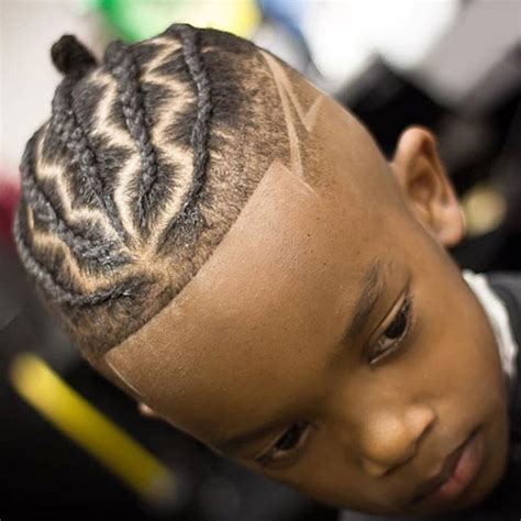 For this style, just brush the hair on both sides downward and the hair at the top upward. 25 Best Black Boys Haircuts (2020 Guide)