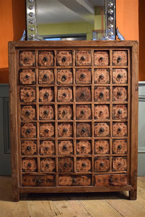 It is made up of a large chest of drawers, which has a lot of square chests that are organized in a rectangle or square. Antique Chinese Apothecary Cabinet Of 45 Drawers | 663306 ...